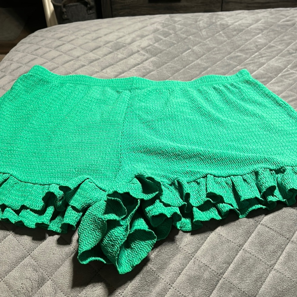 Green crop top with ruffles and ruffle shorts